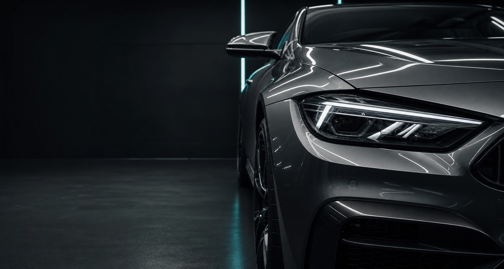A premium vehicle in a detailing bay with glossy protected paint.